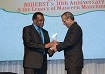 Dr. The Hon. Rupert Griffith, Minister of Science and Technology, and of Sport accepts an Award of recognition from Prof. Prakash Persad for his capable leadership supporting the advancement of NIHERST’s mission.